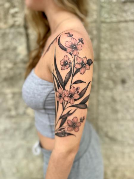 Jessica Johnson - Floral tattoo on the arm